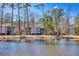 Back exterior view of waterfront condos on a pond, perfect for relaxation and nature viewing at 1221 Tidewater Dr. # 1721, North Myrtle Beach, SC 29582