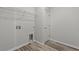 Laundry room with utility hookups, door to the outside, and vinyl flooring at 1227 Cypress Shoal Dr., Conway, SC 29526