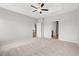 Large main bedroom with a tray ceiling, ceiling fan, and neutral carpeting at 1227 Cypress Shoal Dr., Conway, SC 29526