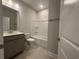 Bathroom featuring a single sink vanity, toilet and shower tub combination at 1229 Lady Bird Way, North Myrtle Beach, SC 29582