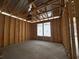 Room shows bare framing, concrete floor and an exterior window view at 1229 Lady Bird Way, North Myrtle Beach, SC 29582