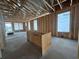 Room framed with windows, concrete floor and a partial wall being erected at 1229 Lady Bird Way, North Myrtle Beach, SC 29582