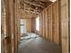 Framed interior showing the floor, unfinished walls and an exterior view at 1229 Lady Bird Way, North Myrtle Beach, SC 29582