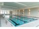 Bright indoor pool with marked lanes and grab rails for accessibility at 1229 Lady Bird Way, North Myrtle Beach, SC 29582