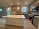 Modern kitchen with gray cabinets, stainless steel appliances, and a white island at 1229 Lady Bird Way, North Myrtle Beach, SC 29582
