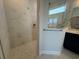 Elegant bathroom with walk-in shower featuring marble tiles and glass enclosure at 1249 Crested Iris Way, North Myrtle Beach, SC 29582