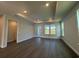 A large room with recessed lighting and three large windows for plenty of natural light at 1249 Crested Iris Way, North Myrtle Beach, SC 29582