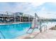 A zero entry pool with a chair lift for those with mobility issues to enjoy the pool at 1249 Crested Iris Way, North Myrtle Beach, SC 29582