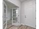 Entryway with wood-look flooring, neutral wall colors, and decorative glass doors at 1249 Crested Iris Way, North Myrtle Beach, SC 29582