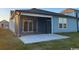Exterior view of home featuring screened in porch and gray siding at 1249 Crested Iris Way, North Myrtle Beach, SC 29582
