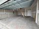 Spacious garage with concrete floor and unfinished drywall at 1249 Crested Iris Way, North Myrtle Beach, SC 29582