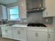 Kitchen featuring white cabinets, stainless steel appliances, and a gas cooktop at 1249 Crested Iris Way, North Myrtle Beach, SC 29582