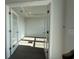 Bright office space is entered via glass french doors and has dark vinyl flooring at 1249 Crested Iris Way, North Myrtle Beach, SC 29582