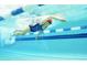 Underwater view of a swimmer doing the crawl in a bright and clean swimming pool at 1249 Crested Iris Way, North Myrtle Beach, SC 29582