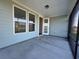 A covered porch features a ceiling fan, access to the house, and screens at 1249 Crested Iris Way, North Myrtle Beach, SC 29582