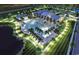 Aerial view of community pool with palm trees, lounge chairs, and lush landscaping at dusk at 1253 Crested Iris Way, North Myrtle Beach, SC 29582