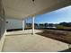 Covered back porch overlooking pond, offering serene outdoor living space at 1253 Crested Iris Way, North Myrtle Beach, SC 29582