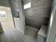Modern bathroom with gray tile shower, bench, and sleek design at 1253 Crested Iris Way, North Myrtle Beach, SC 29582
