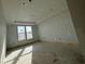 Bright bedroom with large window, neutral walls, and natural light at 1253 Crested Iris Way, North Myrtle Beach, SC 29582