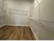 Walk in closet with wire shelving and wood floor at 1253 Crested Iris Way, North Myrtle Beach, SC 29582