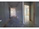Hallway view showcasing natural wood trim and bright, airy rooms at 1253 Crested Iris Way, North Myrtle Beach, SC 29582