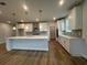 Modern kitchen featuring a large island, stainless appliances, and stylish pendant lighting at 1253 Crested Iris Way, North Myrtle Beach, SC 29582