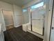 Bathroom featuring shower with glass door and tiled walls at 1257 Crested Iris Way, North Myrtle Beach, SC 29582