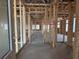 Unfinished home interior with exposed framing and concrete flooring at 1257 Crested Iris Way, North Myrtle Beach, SC 29582