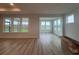 Open-concept living room with an abundance of windows, providing natural light and scenic views at 1257 Crested Iris Way, North Myrtle Beach, SC 29582