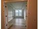 Bright office space featuring luxury vinyl plank flooring and a large window overlooking the neighborhood at 1257 Crested Iris Way, North Myrtle Beach, SC 29582