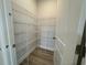 Well-organized pantry with wire shelving, providing ample storage for kitchen essentials at 1257 Crested Iris Way, North Myrtle Beach, SC 29582