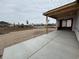 View from covered patio with new concrete, looking toward community buildings at 1257 Crested Iris Way, North Myrtle Beach, SC 29582