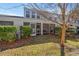 Exterior of a home with a screened in porch, mature trees, and bushes at 1298 Harvester Circle # 1298, Myrtle Beach, SC 29579