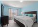 Bright bedroom with neutral curtains, a spacious bed and dark furniture for storage at 1298 Harvester Circle # 1298, Myrtle Beach, SC 29579