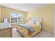 Bright bedroom with a large window, a cozy bed, and neutral decor at 1298 Harvester Circle # 1298, Myrtle Beach, SC 29579
