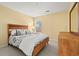 Bedroom features a wooden bed frame and a matching set of furniture for storage at 1298 Harvester Circle # 1298, Myrtle Beach, SC 29579
