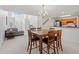 Open dining area highlights a wooden table with seating for six and views to kitchen and living areas at 1298 Harvester Circle # 1298, Myrtle Beach, SC 29579