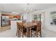 Eat-in dining area features a chandelier, wood table, and sliding glass doors to the exterior at 1298 Harvester Circle # 1298, Myrtle Beach, SC 29579