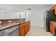 Open kitchen with stainless steel appliances and a breakfast bar overlooking the dining area at 1298 Harvester Circle # 1298, Myrtle Beach, SC 29579