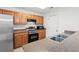 Functional kitchen with stainless steel appliances, ample counter space, and wooden cabinets at 1298 Harvester Circle # 1298, Myrtle Beach, SC 29579