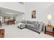 Spacious living room showcases high ceilings, a sectional sofa, and open access to dining area at 1298 Harvester Circle # 1298, Myrtle Beach, SC 29579