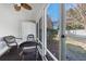 Relaxing screened porch with ceiling fan and wicker chairs provides a cozy outdoor space at 1298 Harvester Circle # 1298, Myrtle Beach, SC 29579