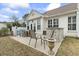 Outdoor patio with grill, seating and view of back of home at 14 Cobblestone Dr., Pawleys Island, SC 29585