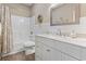 Bright bathroom with a white vanity, marble countertop, and a shower/tub combo at 14 Cobblestone Dr., Pawleys Island, SC 29585