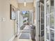 Entryway with decorative front door, leading into a home with neutral walls and wood-look flooring at 14 Cobblestone Dr., Pawleys Island, SC 29585