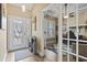 Elegant foyer featuring decorative glass doors, wood floors, and an adjacent office space at 14 Cobblestone Dr., Pawleys Island, SC 29585