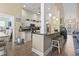 Bright kitchen with granite countertops, white cabinets and stainless steel appliances and center island with bar stool seating at 14 Cobblestone Dr., Pawleys Island, SC 29585