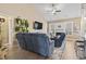 Living room with fireplace, large TV, ceiling fan, and comfortable seating at 14 Cobblestone Dr., Pawleys Island, SC 29585