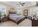 Spacious main bedroom with ceiling fan, plantation shutters, and decorative accents at 14 Cobblestone Dr., Pawleys Island, SC 29585