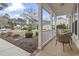 Inviting porch with outdoor seating, offering a relaxing space to enjoy the neighborhood views at 14 Cobblestone Dr., Pawleys Island, SC 29585